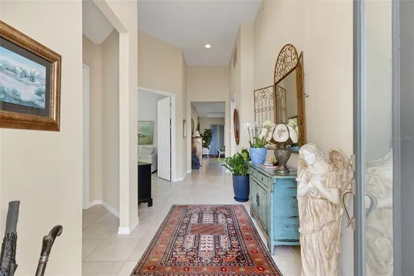 a hallway with furniture and wooden floor