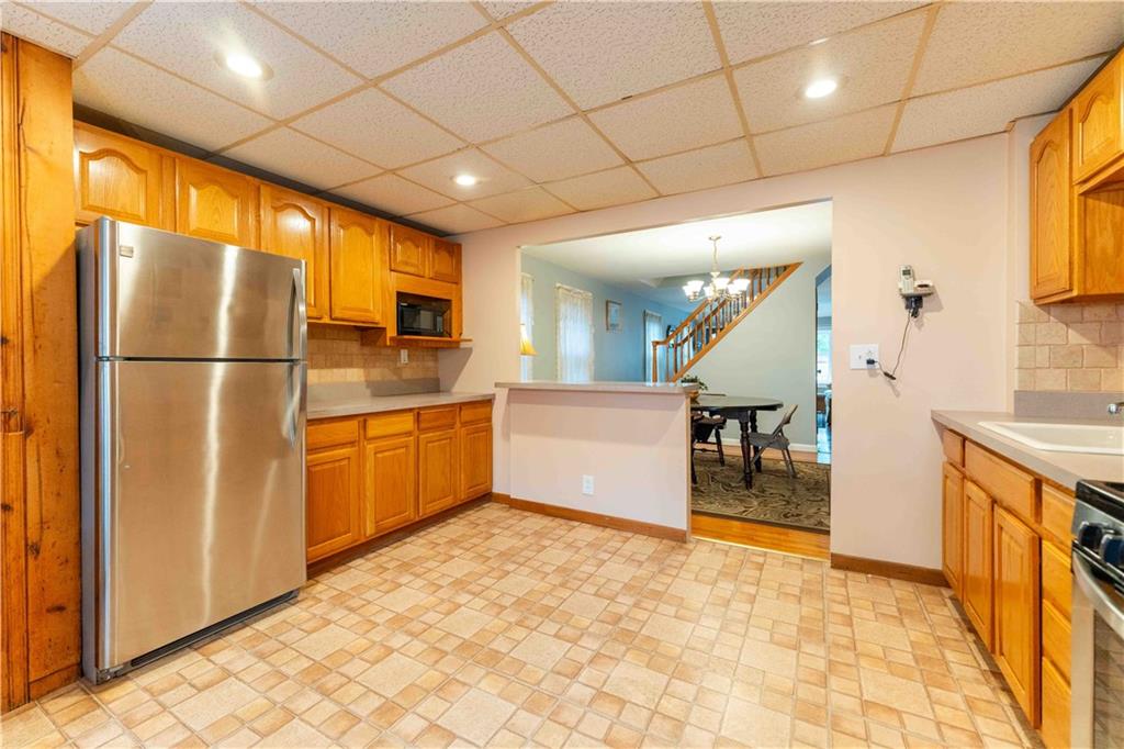 2222 Stuart Street Brooklyn, NY 11229 - Photo 13 of 31 a kitchen with sink cabinets and refrigerator