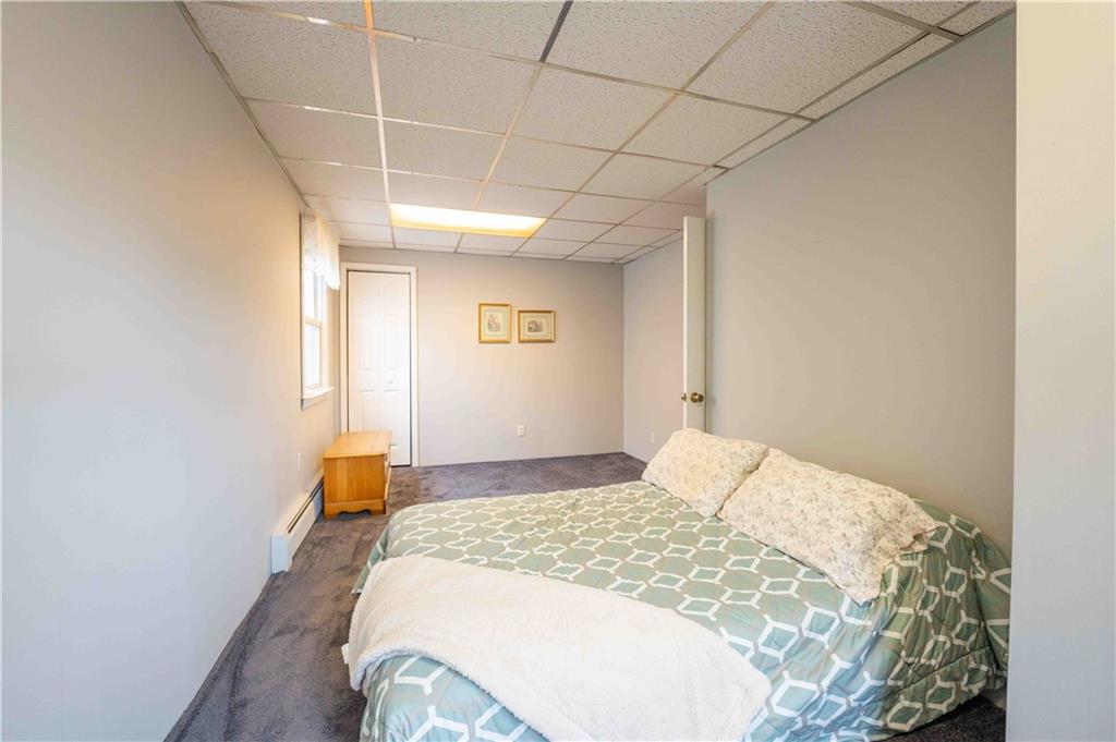 2222 Stuart Street Brooklyn, NY 11229 - Photo 20 of 31 a bedroom with a bed and a window