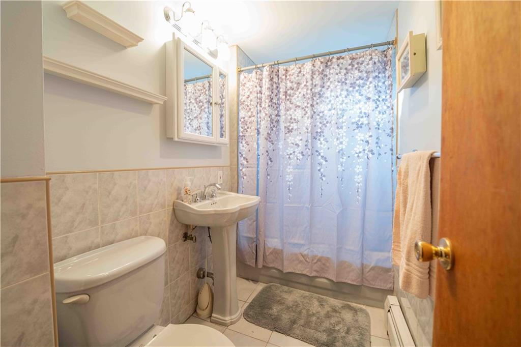 2222 Stuart Street Brooklyn, NY 11229 - Photo 21 of 31 a bathroom with a sink a toilet and shower