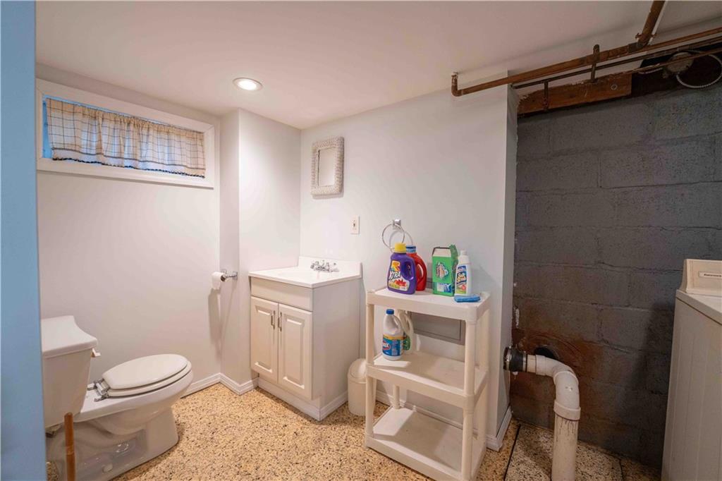 2222 Stuart Street Brooklyn, NY 11229 - Photo 24 of 31 a bathroom with a toilet and a shower