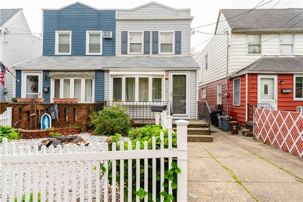 2222 Stuart Street Brooklyn, NY 11229 - Photo 3 of 31 front view of a house with a small yard