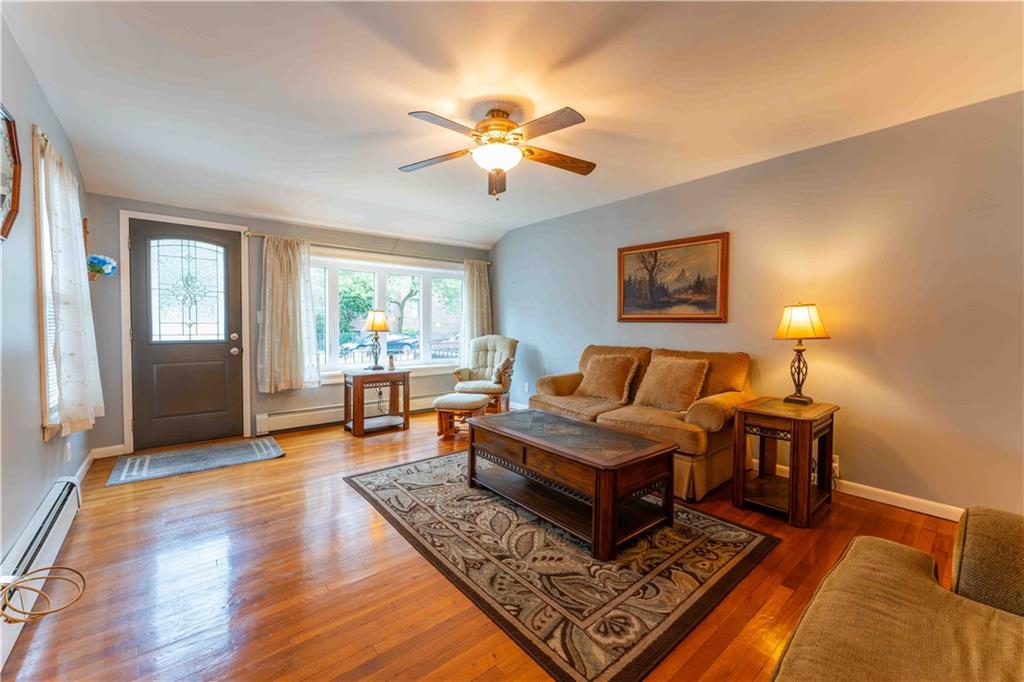 2222 Stuart Street Brooklyn, NY 11229 - Photo 6 of 31 a living room with furniture and a window