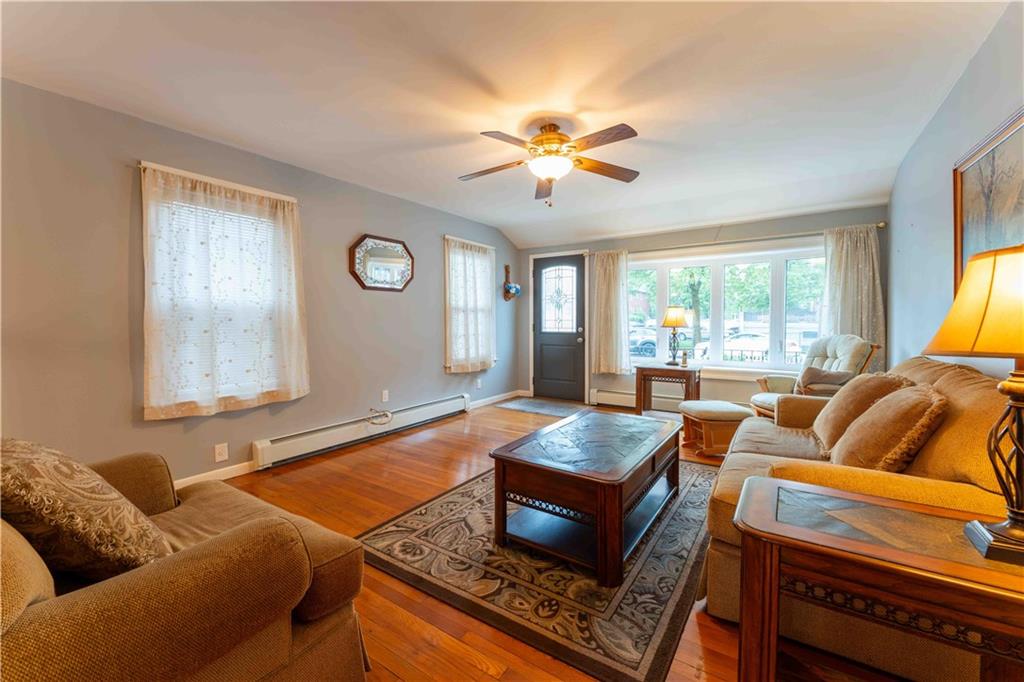 2222 Stuart Street Brooklyn, NY 11229 - Photo 7 of 31 a living room with furniture and a large window