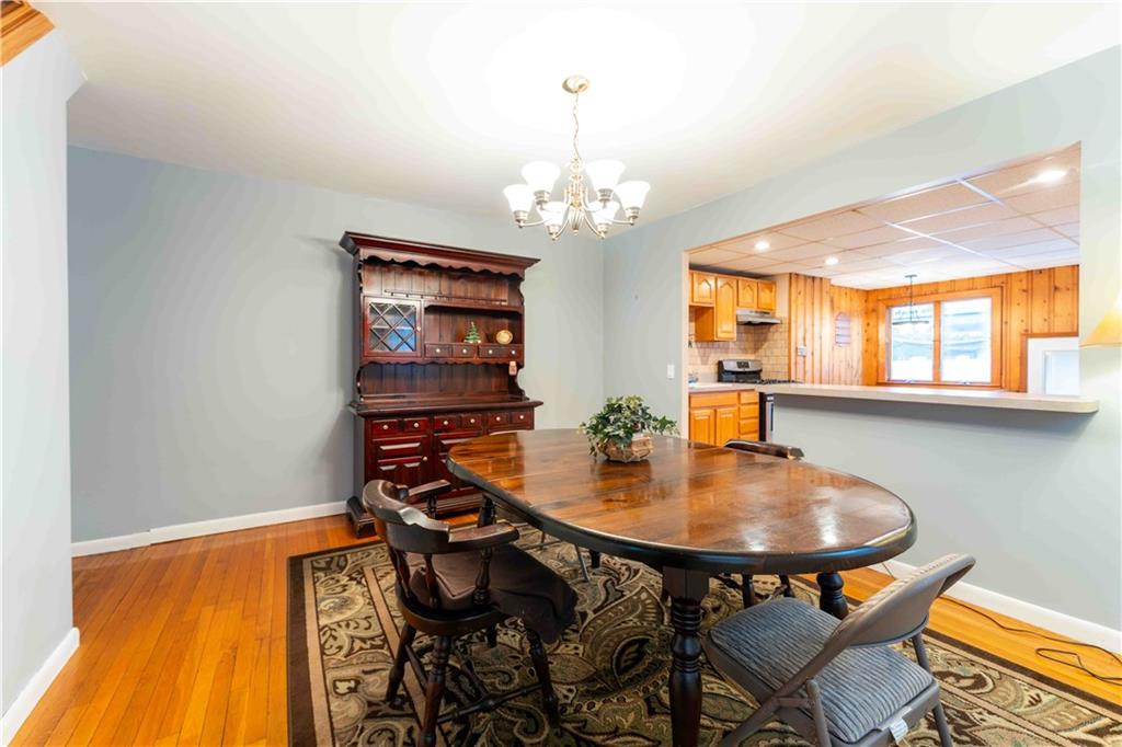 2222 Stuart Street Brooklyn, NY 11229 - Photo 9 of 31 a view of a dining room with furniture and a chandelier