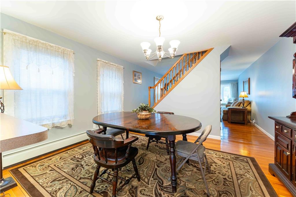 2222 Stuart Street Brooklyn, NY 11229 - Photo 10 of 31 a view of a dining room with furniture and wooden floor