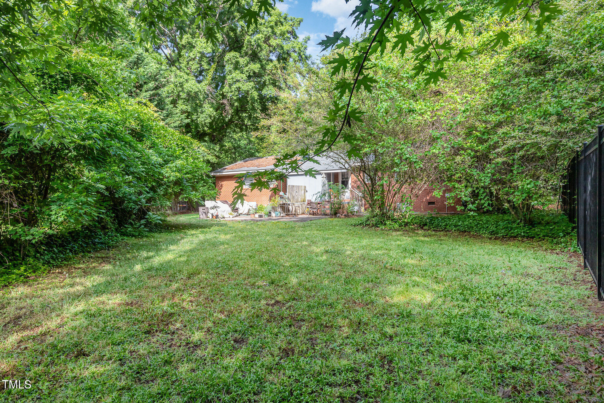 603 Kildaire Farm Road, Unit 603605 Cary, NC 27511 - Photo 11 of 14 a view of house with backyard