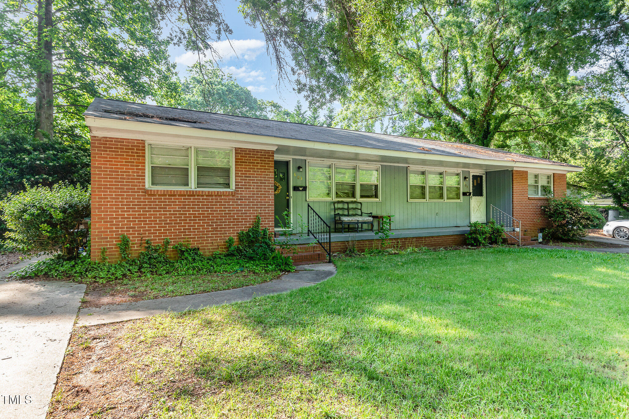 603 Kildaire Farm Road, Unit 603605 Cary, NC 27511 - Photo 8 of 14 front view of a house with a yard