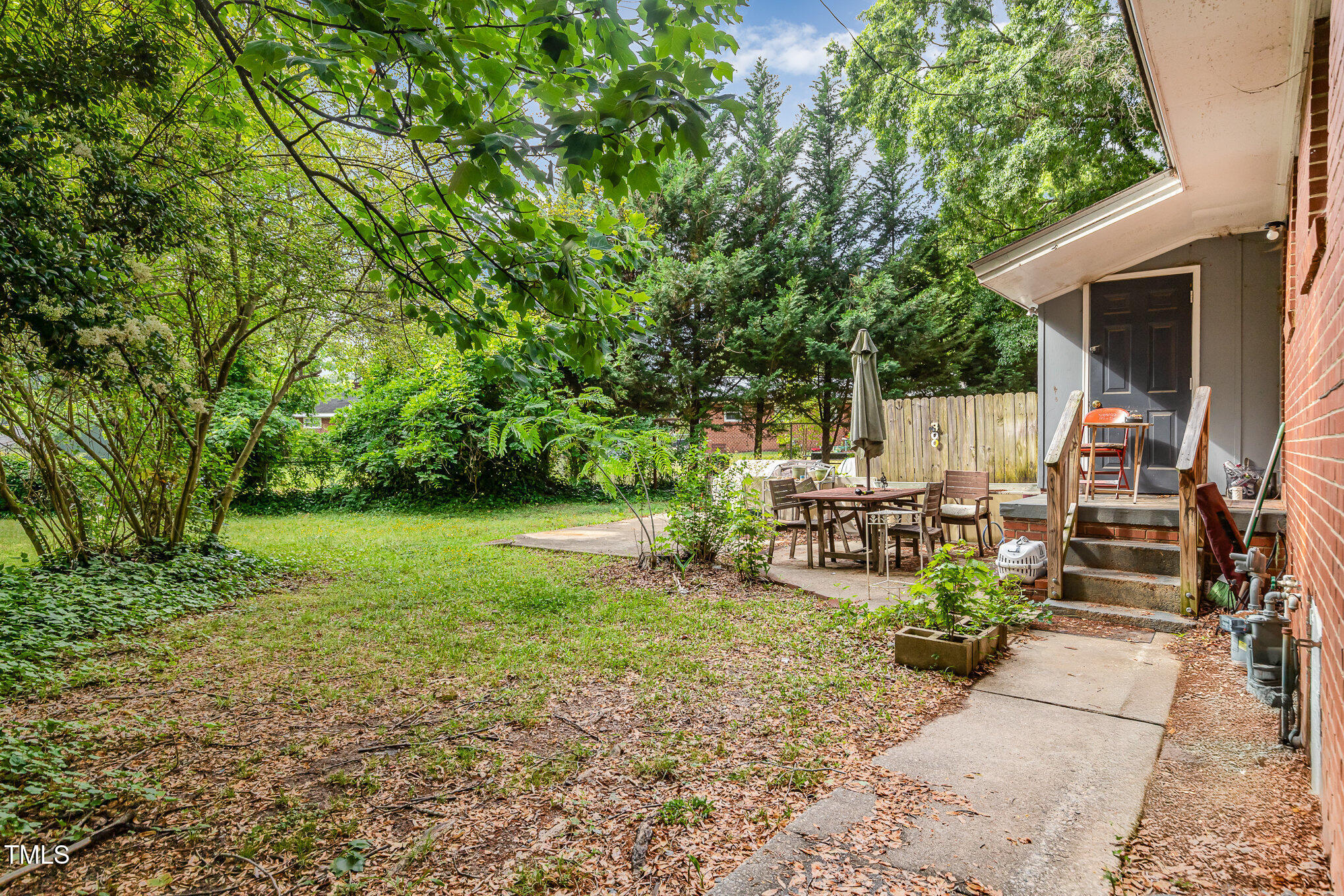 603 Kildaire Farm Road, Unit 603605 Cary, NC 27511 - Photo 10 of 14 a view of a house with backyard porch and sitting area