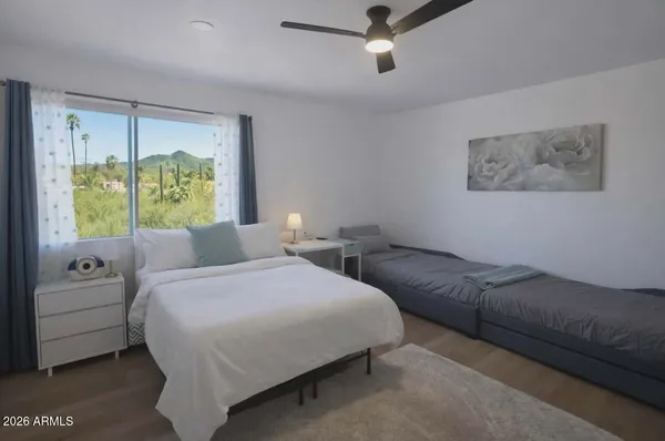 a bedroom with a bed and a couch