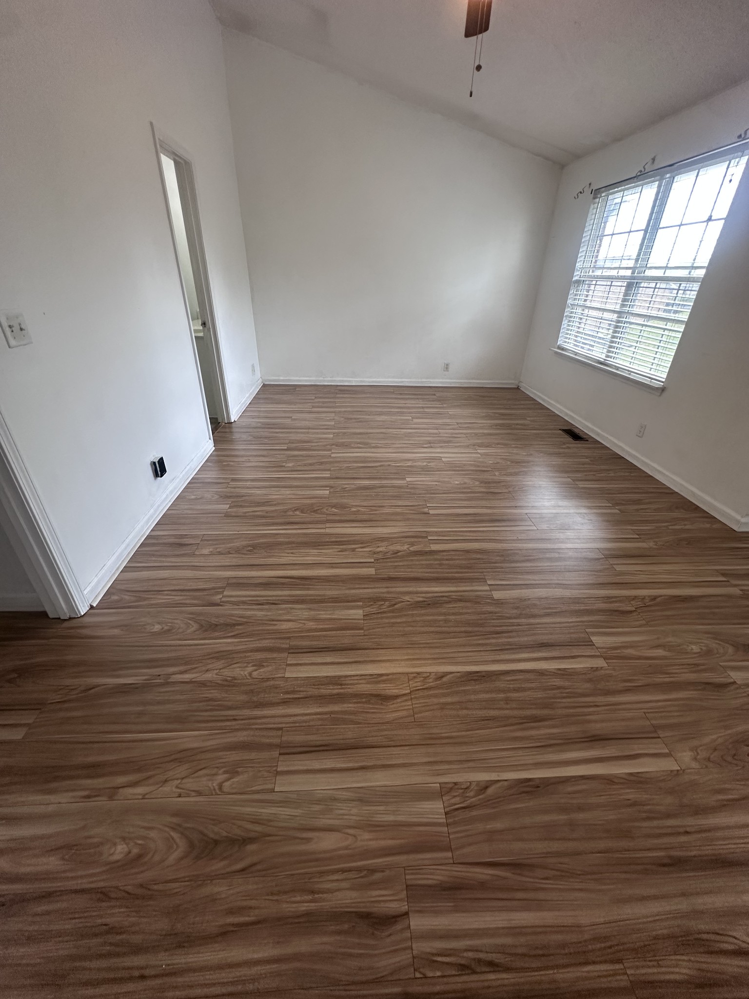 3001 Hamilton Church Road, Unit 403 Antioch, TN 37013 - Photo 17 of 21 an empty room with wooden floor and windows