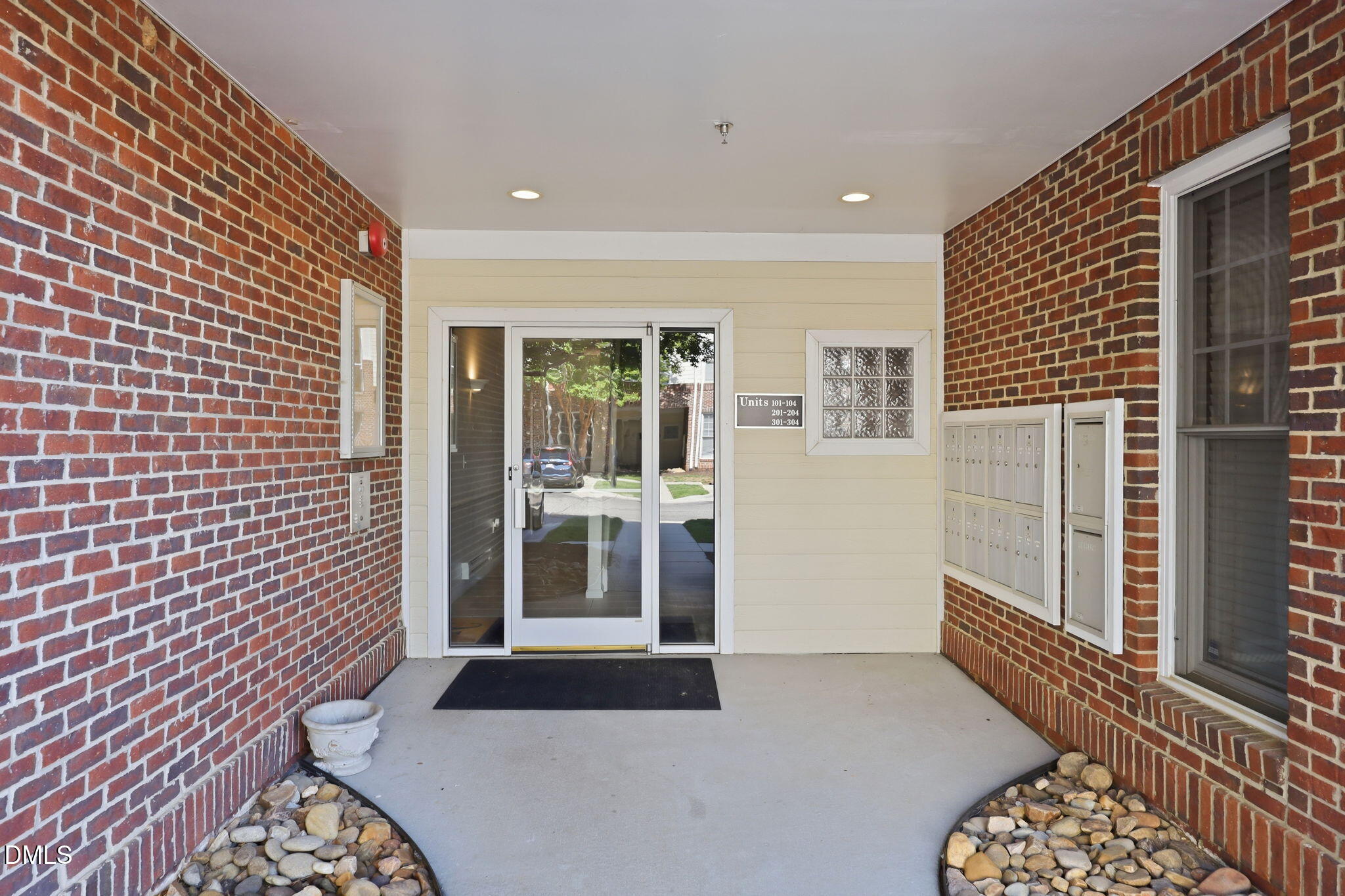 801 Moratuck Drive, Unit 202 Raleigh, NC 27604 - Photo 4 of 23 a bedroom with a bed and a window