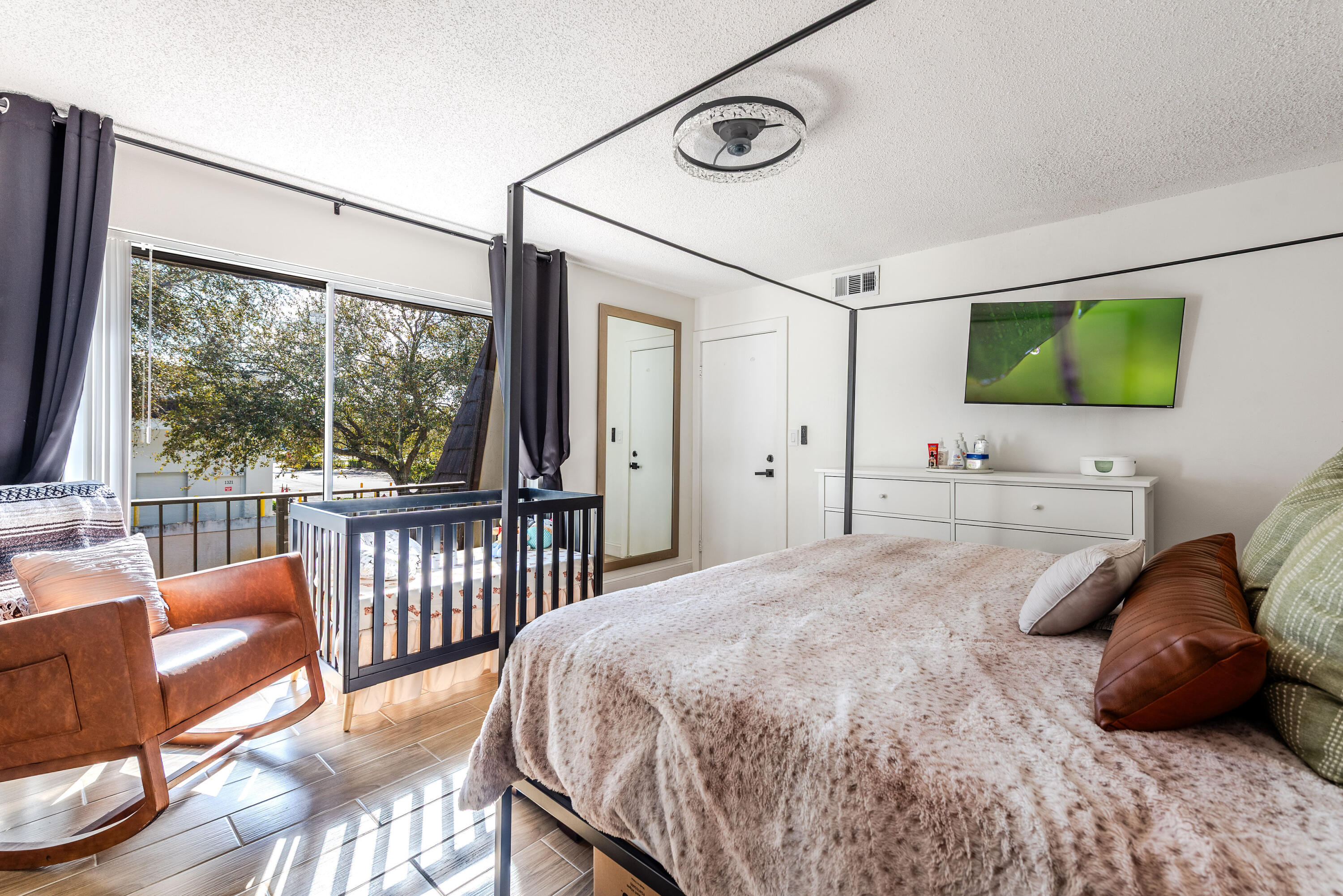 4572 Cherry Road West Palm Beach, FL 33417 - Photo 14 of 27 a bedroom with a bed couch and a window