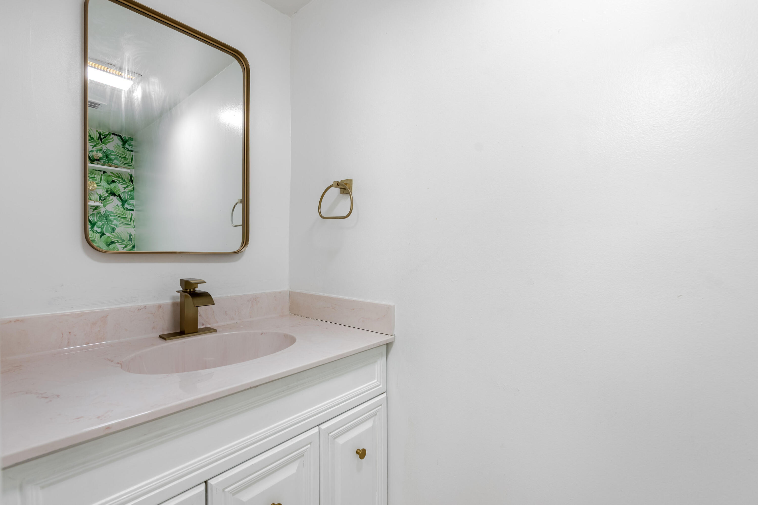 4572 Cherry Road West Palm Beach, FL 33417 - Photo 19 of 27 a bathroom with a sink and a mirror