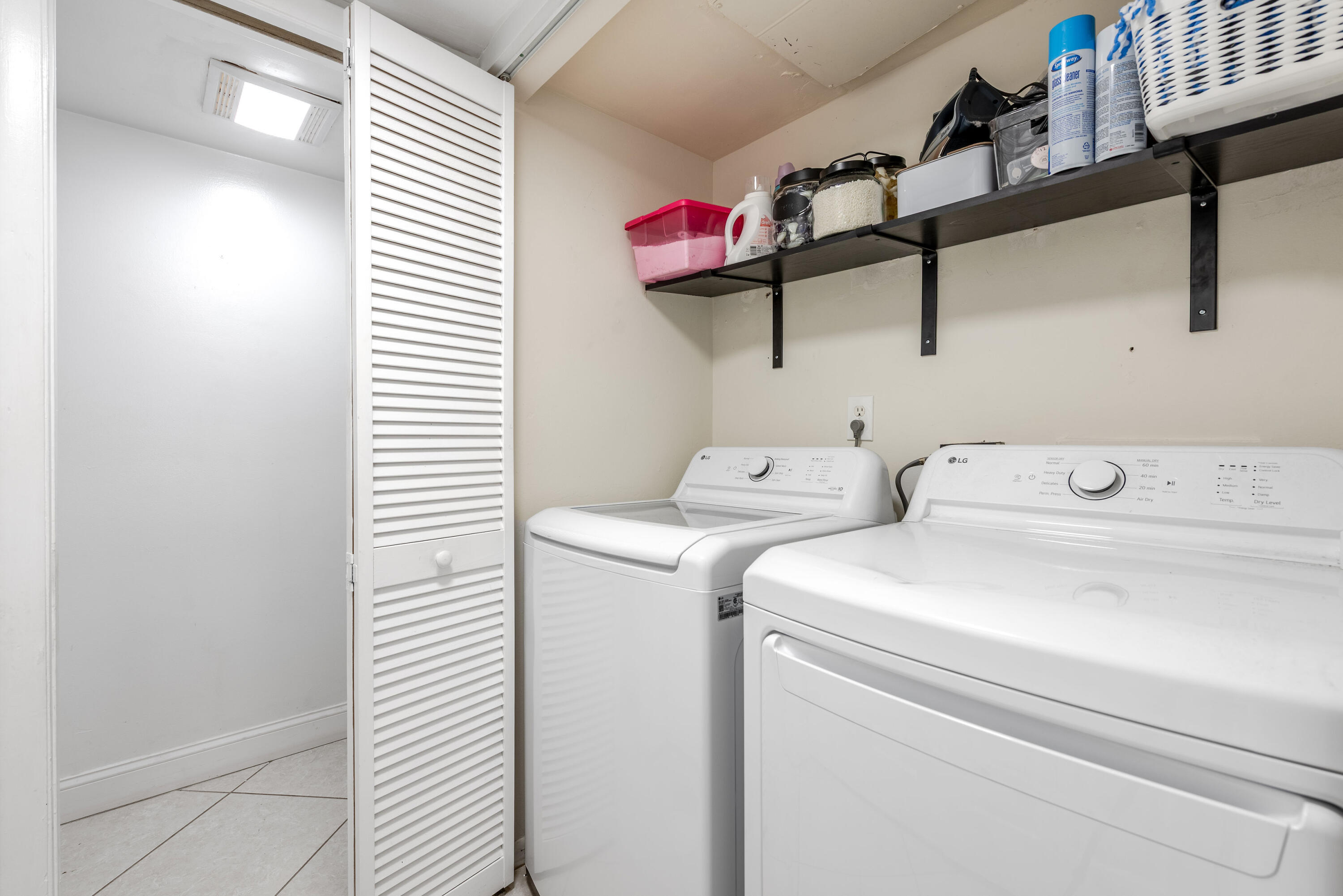 4572 Cherry Road West Palm Beach, FL 33417 - Photo 20 of 27 a view of storage and utility room with washer and dryer