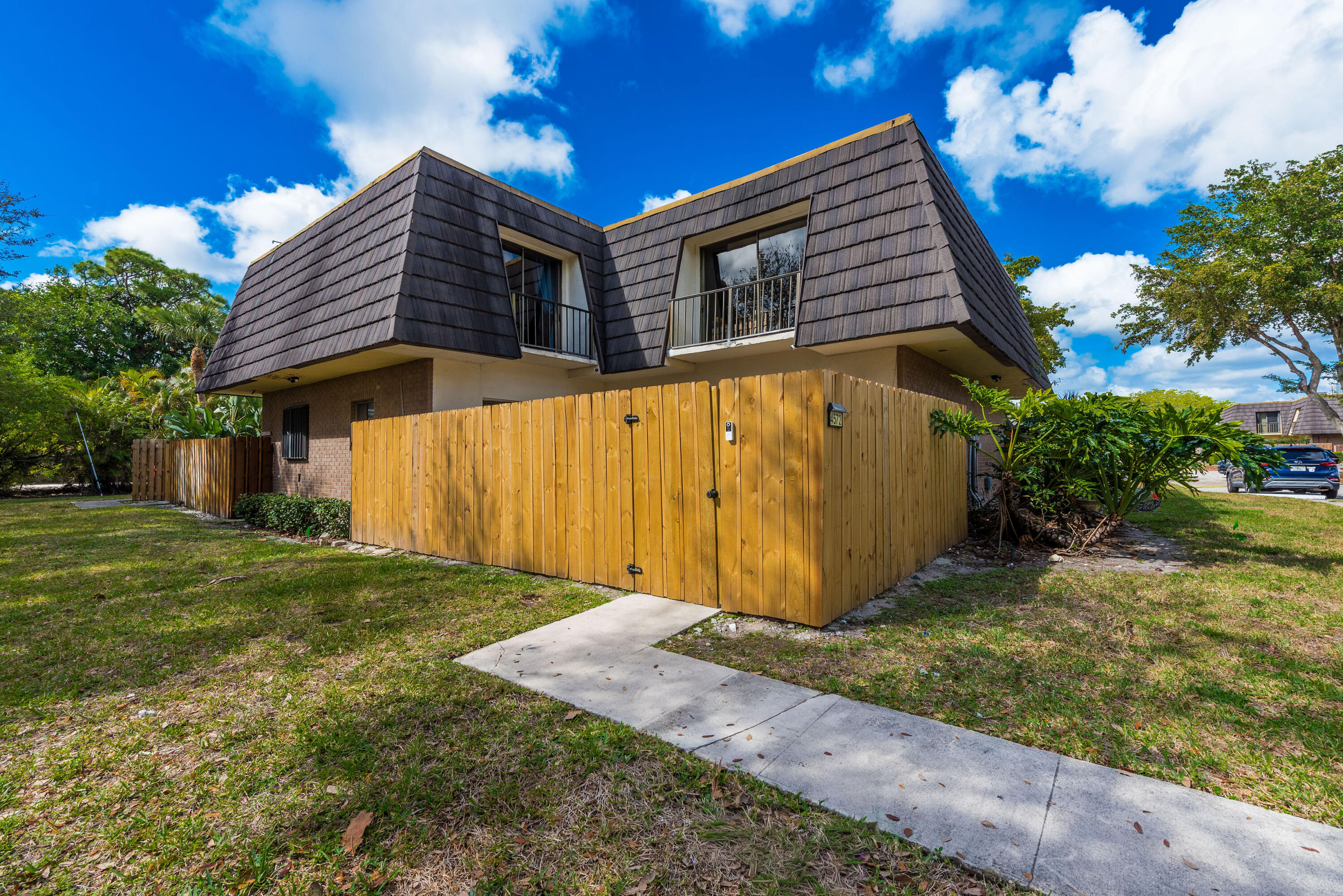 4572 Cherry Road West Palm Beach, FL 33417 - Photo 2 of 27 a view of a house with a yard