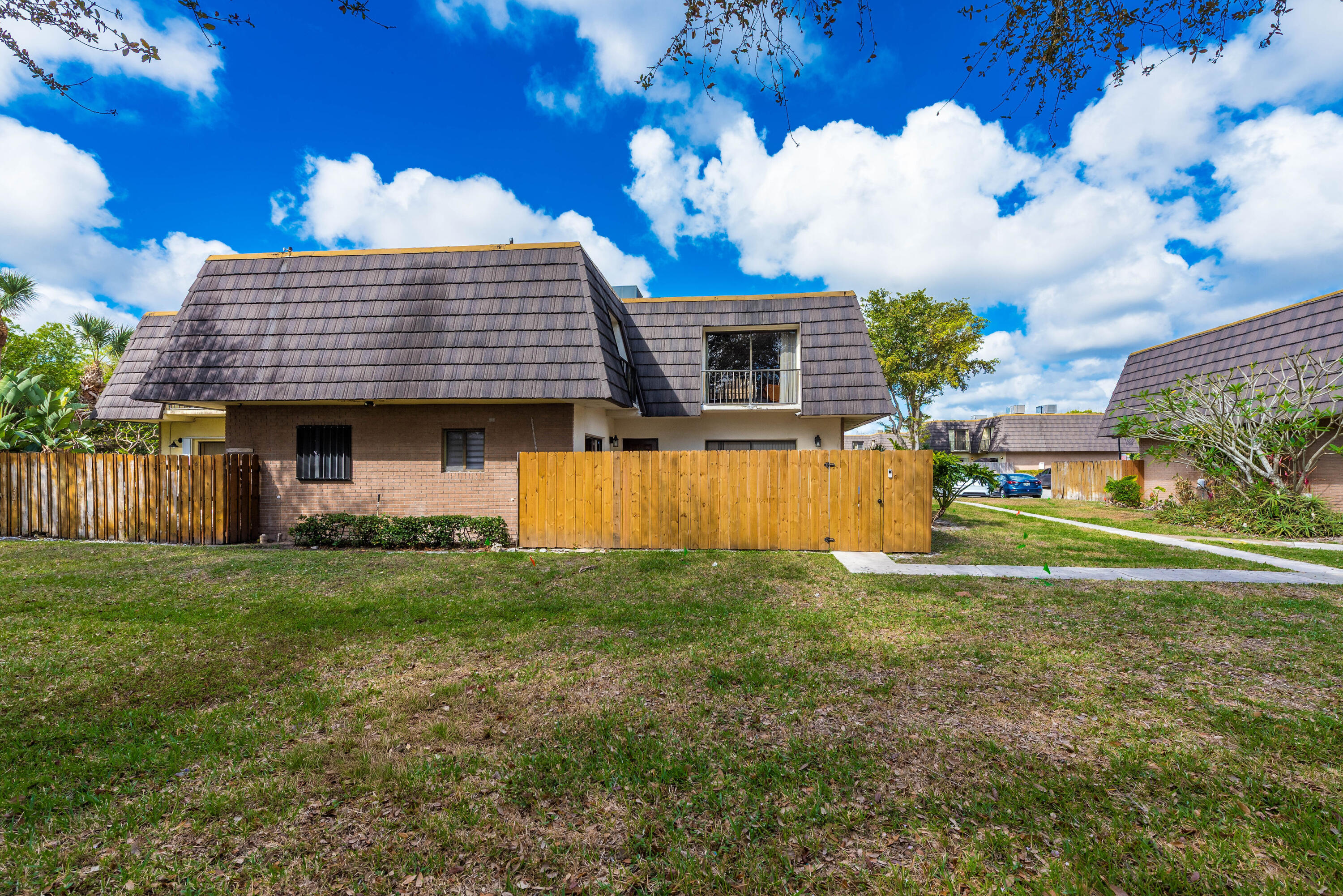 4572 Cherry Road West Palm Beach, FL 33417 - Photo 25 of 27 a view of a house with a backyard
