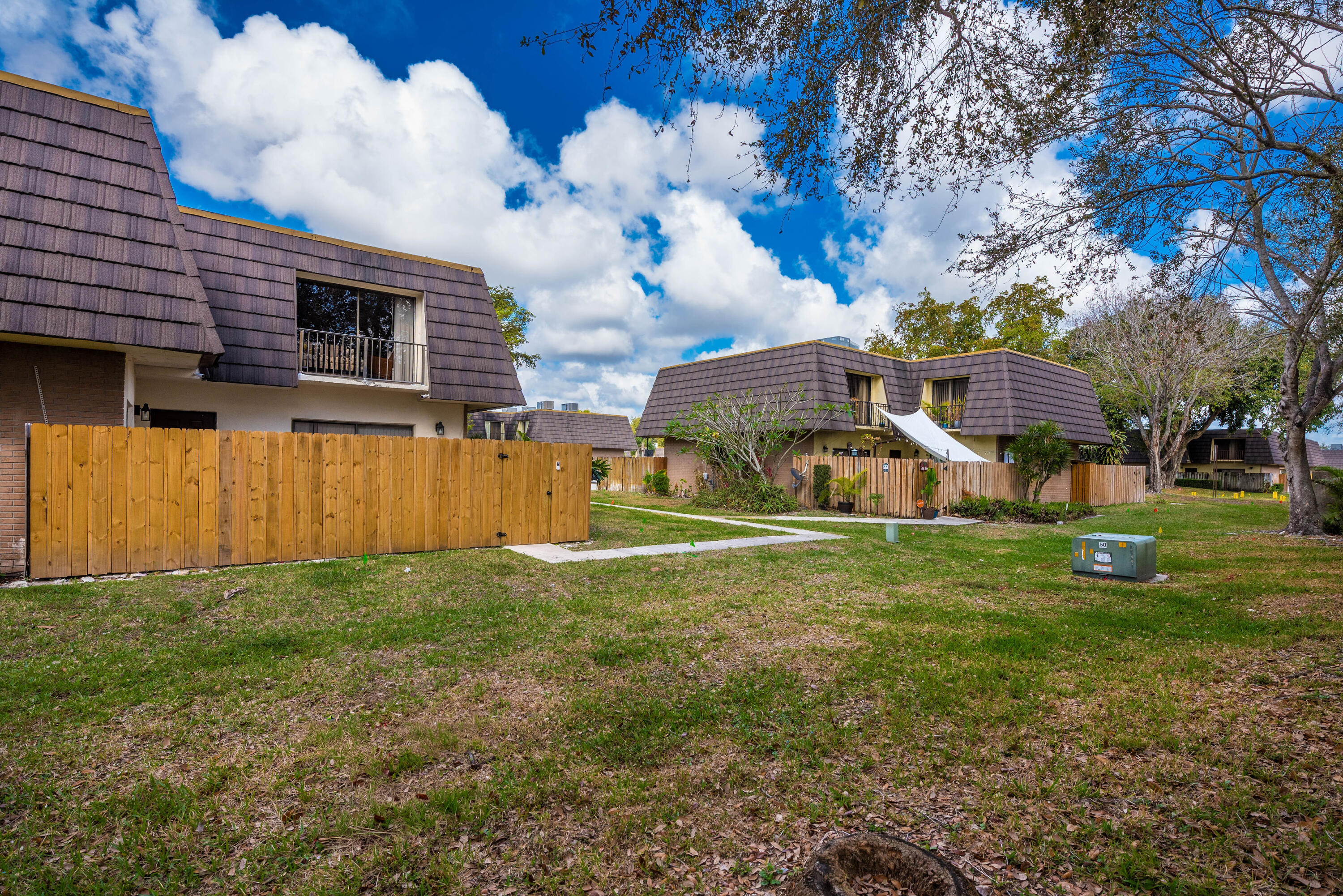 4572 Cherry Road West Palm Beach, FL 33417 - Photo 26 of 27 a view of a house with a yard