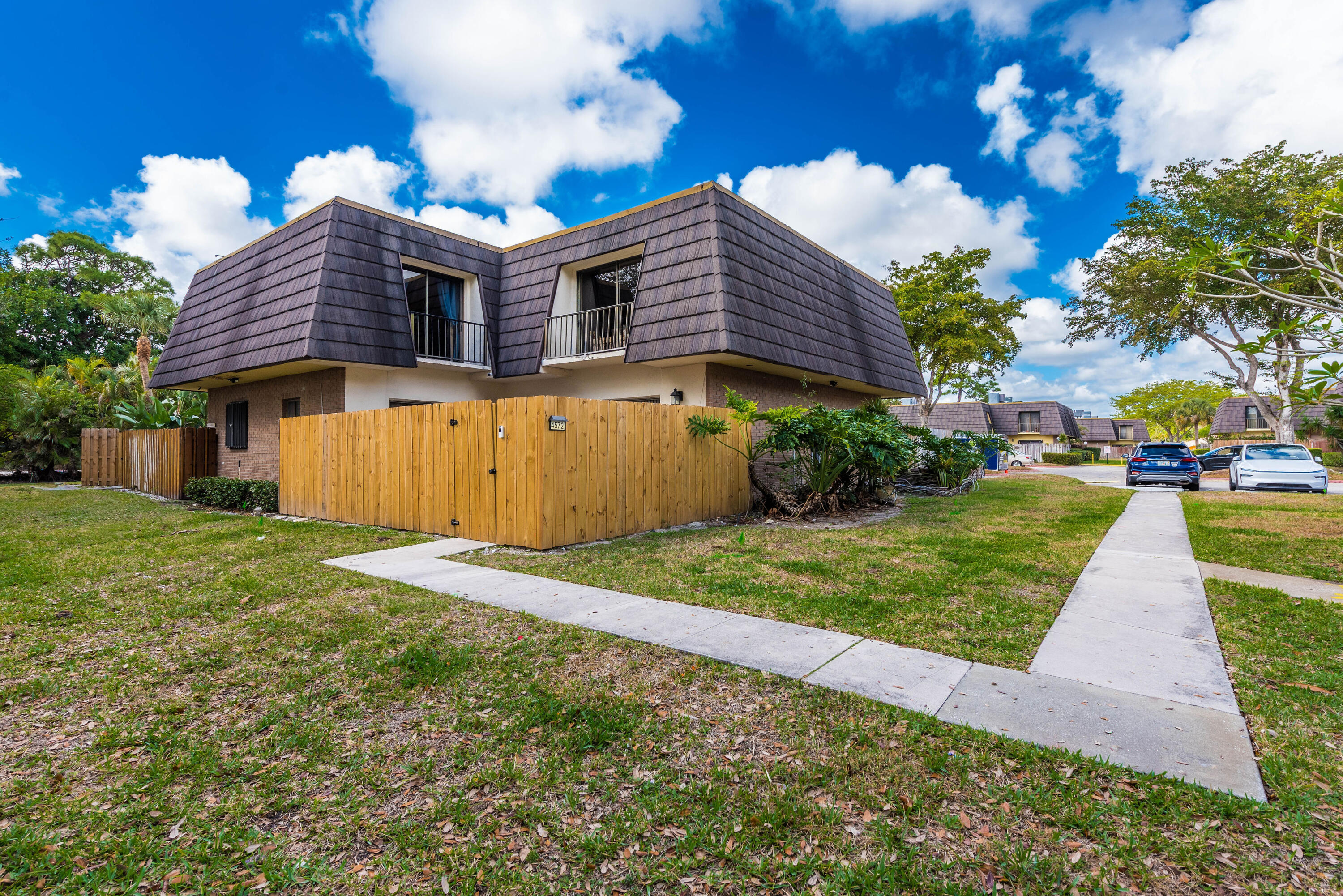 4572 Cherry Road West Palm Beach, FL 33417 - Photo 27 of 27 a front view of a house with a yard