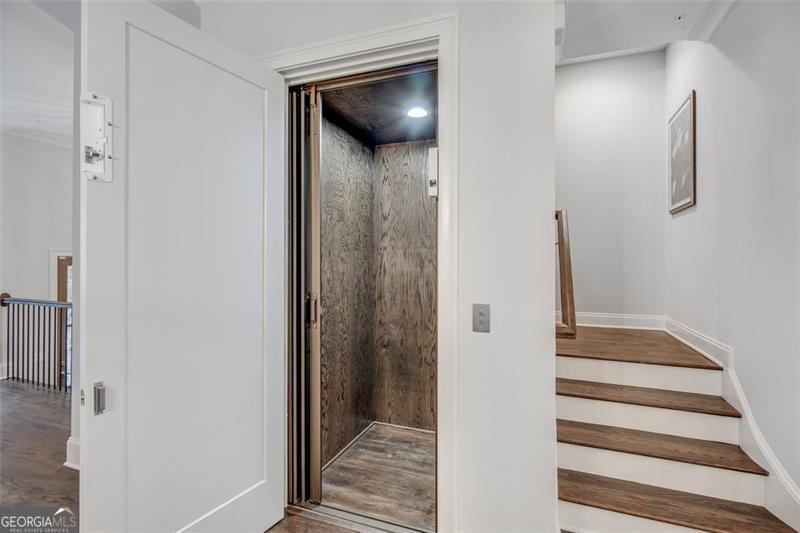3450 Commander Suwanee, GA 30024 - Photo 23 of 52 a view of a hallway with wooden floor and entryway