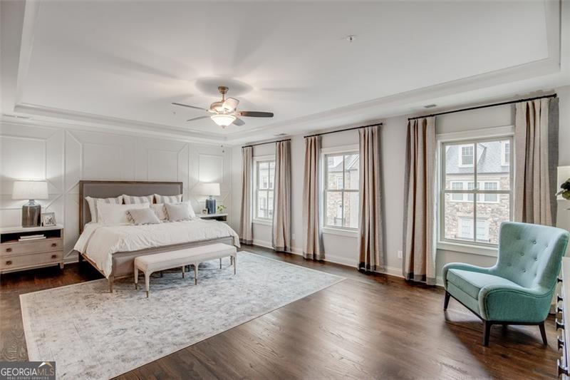 3450 Commander Suwanee, GA 30024 - Photo 24 of 52 a spacious bedroom with a bed a couch and a large window