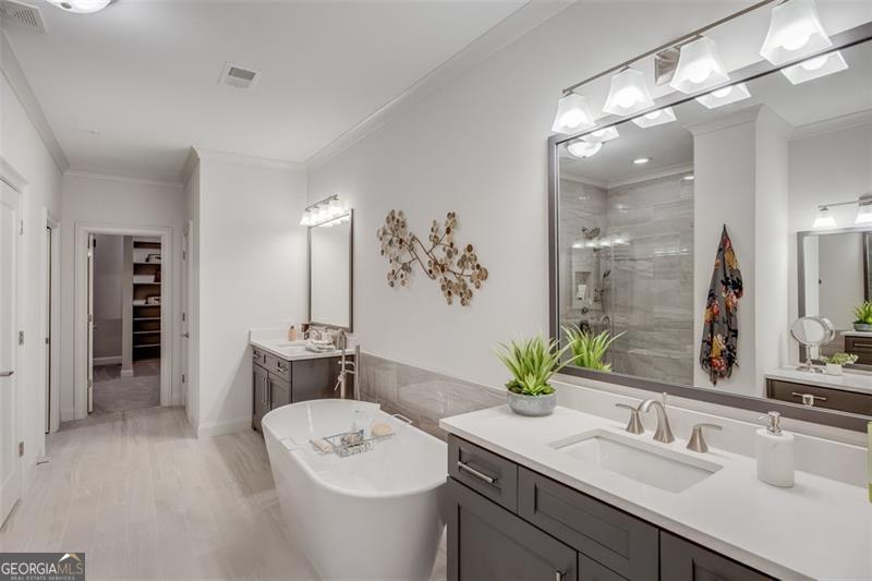 3450 Commander Suwanee, GA 30024 - Photo 25 of 52 a bathroom with a sink double vanity and a mirror