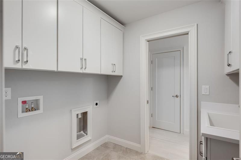 3450 Commander Suwanee, GA 30024 - Photo 29 of 52 a view of cabinets and wooden floor