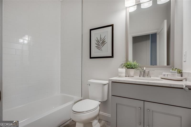 3450 Commander Suwanee, GA 30024 - Photo 31 of 52 a bathroom with a toilet sink and mirror