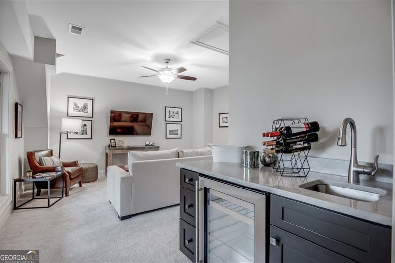 3450 Commander Suwanee, GA 30024 - Photo 34 of 52 a kitchen with a sink cabinets and wooden floor