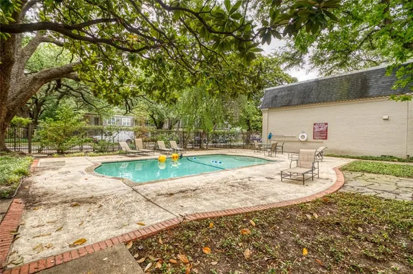 a view of a swimming pool with a patio