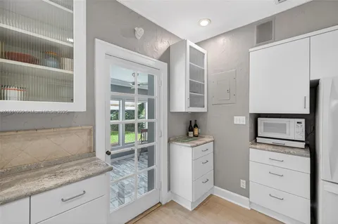 a bedroom that has a bed and a table in it