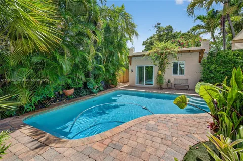 a backyard of a house with seating space