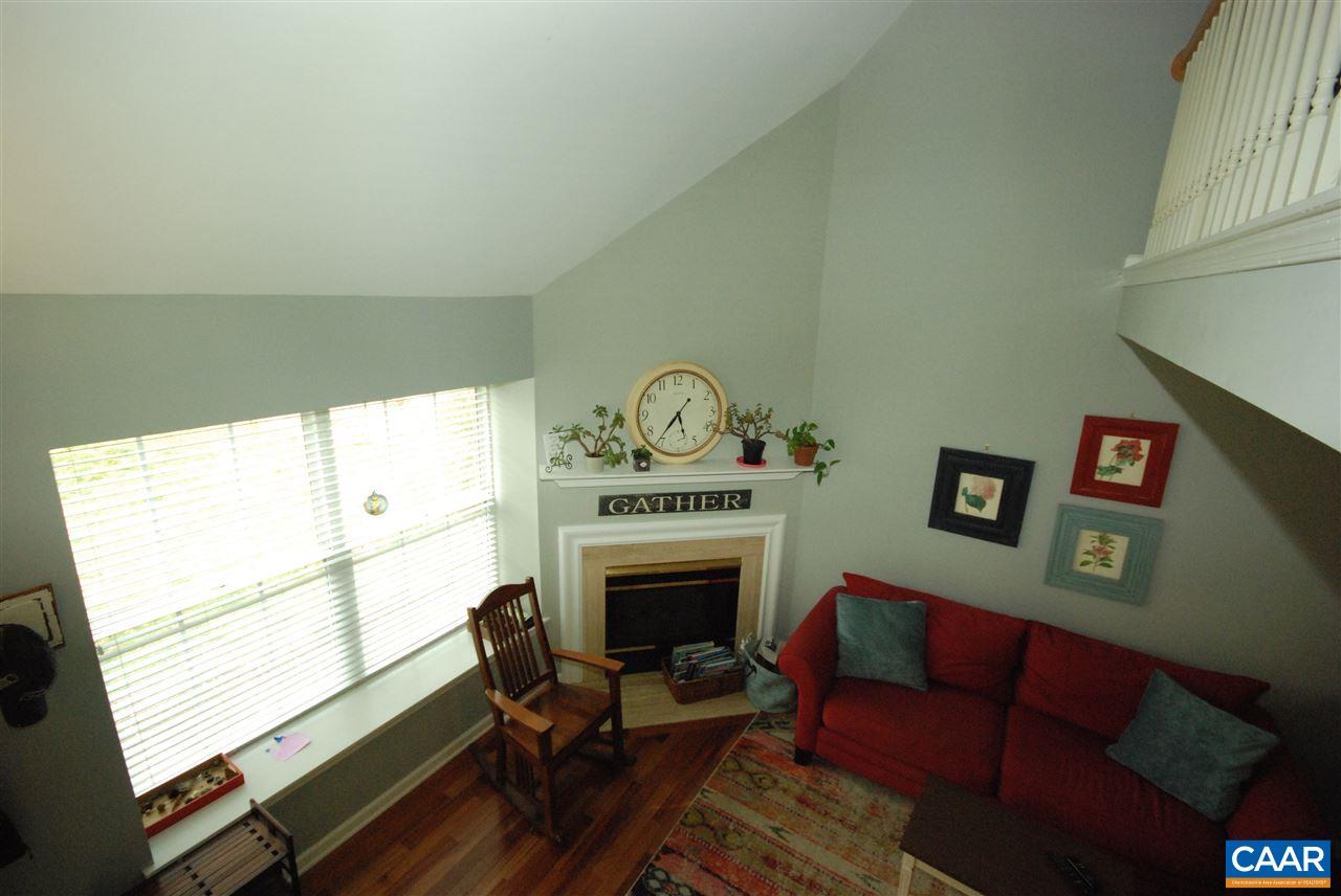 987 Amber Ridge Road Charlottesville, VA 22901 - Photo 15 of 19 a living room with furniture a fireplace and a large window