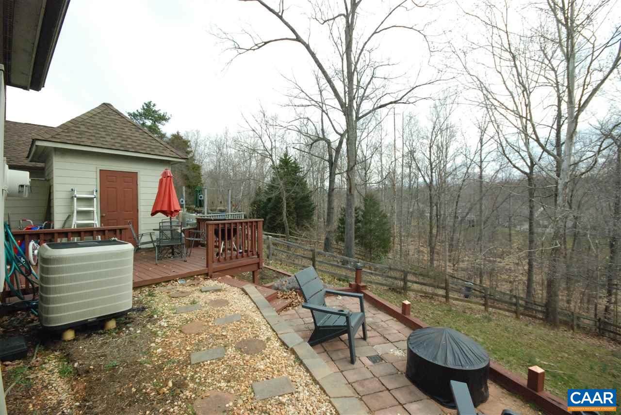 987 Amber Ridge Road Charlottesville, VA 22901 - Photo 17 of 19 a view of a patio with couches chairs and a fire pit