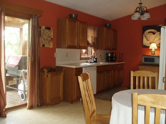 882 South Trainer Road Rockford, IL 61108 - Photo 2 of 6 a kitchen with a table chairs refrigerator and cabinets