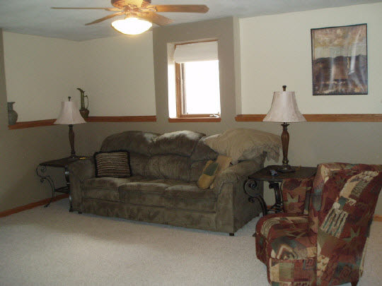 882 South Trainer Road Rockford, IL 61108 - Photo 4 of 6 a living room with furniture and a window