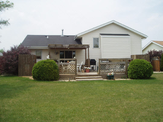 882 South Trainer Road Rockford, IL 61108 - Photo 5 of 6 a view of a house with a yard and sitting area