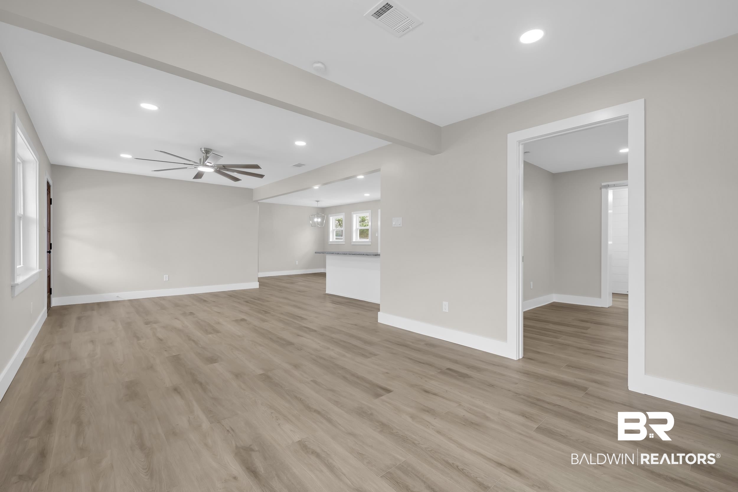11381 Normandy Drive East Semmes, AL 36575 - Photo 5 of 23 Unfurnished living room featuring recessed lighting, a ceiling fan, light wood-style floors, and beam ceiling