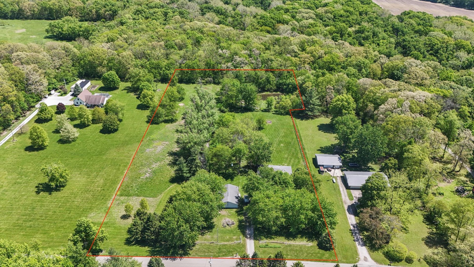 2431 North 1450 East Road Mansfield, IL 61854 - Photo 5 of 78 an aerial view of a house with a yard