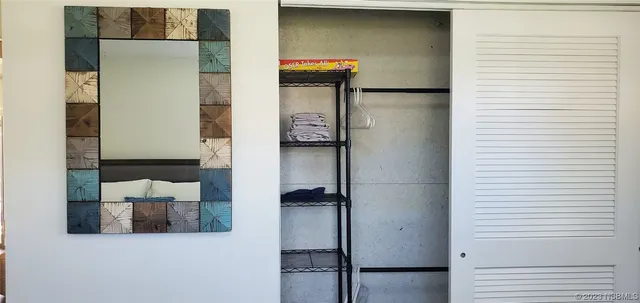 a bathroom with a shower and a toilet next to a window