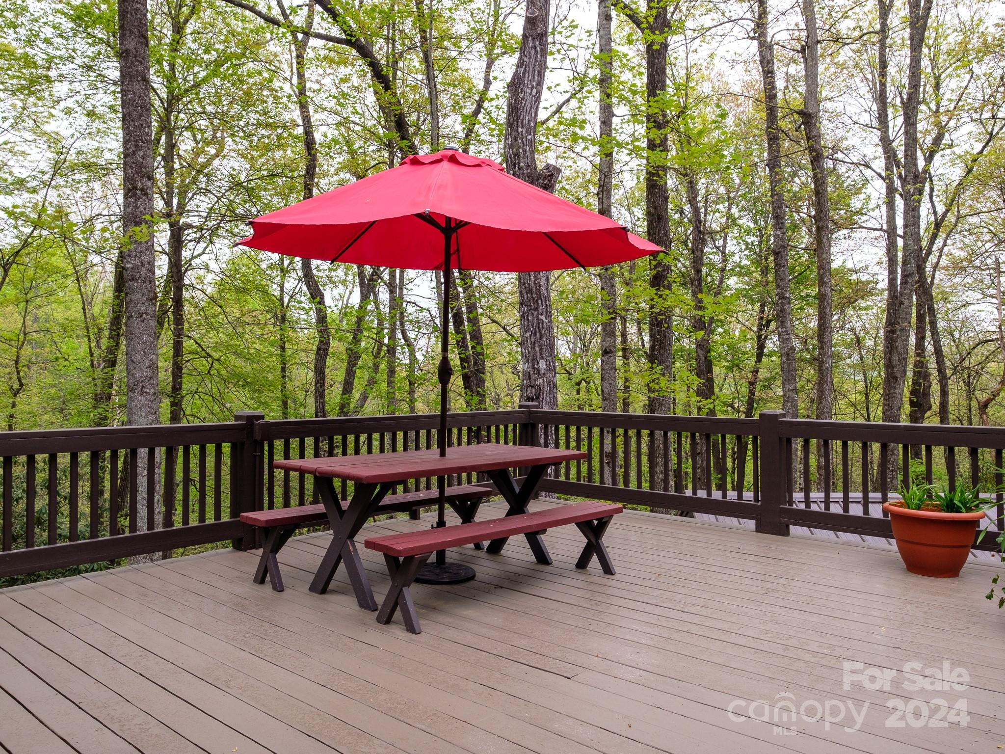 145 Catatoga Path Brevard, NC 28712 - Photo 16 of 41 a view of balcony with wooden floor outdoor seating and wooden floor