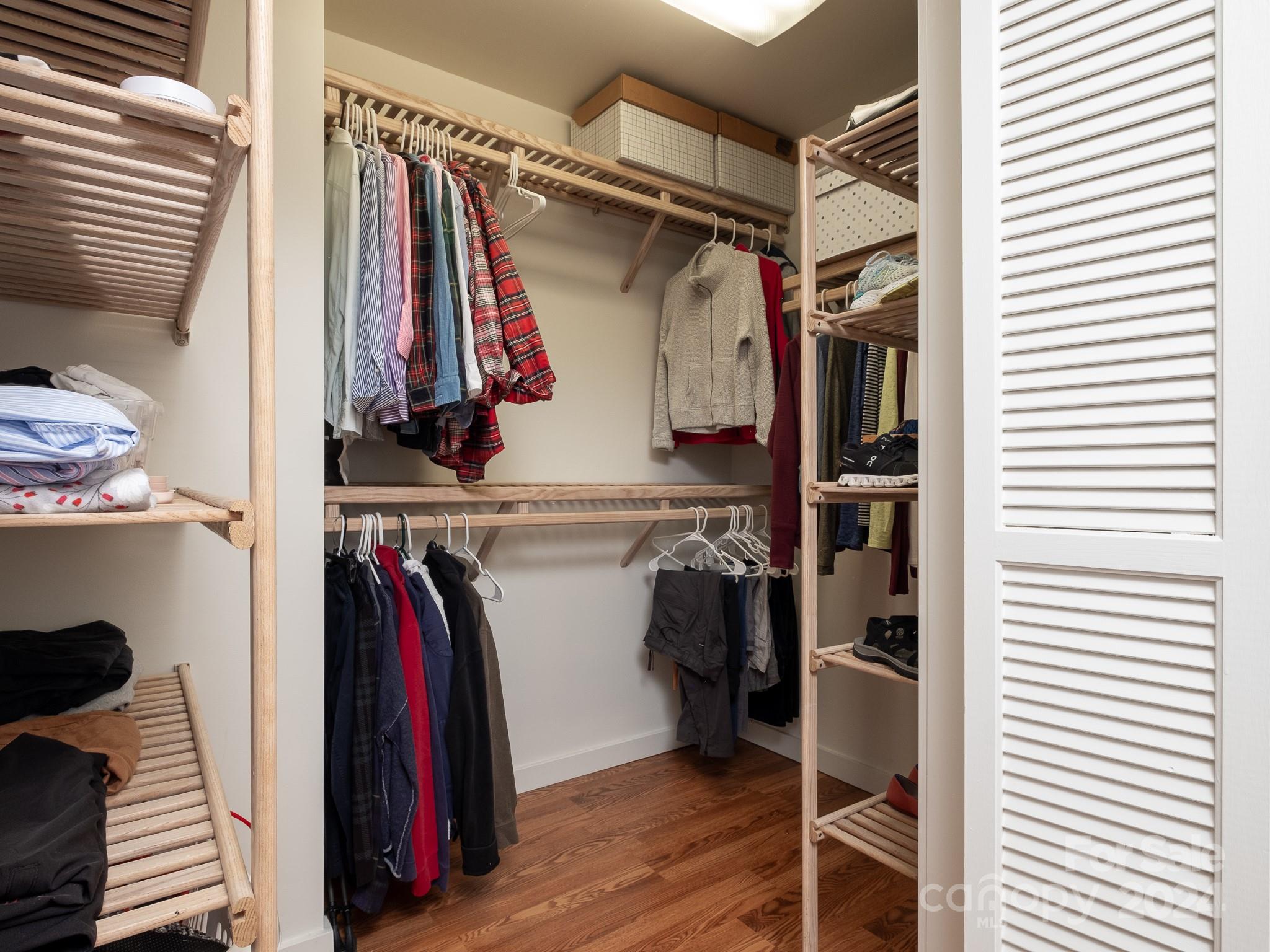 145 Catatoga Path Brevard, NC 28712 - Photo 20 of 41 a view of walk in closet with clothes and shoes