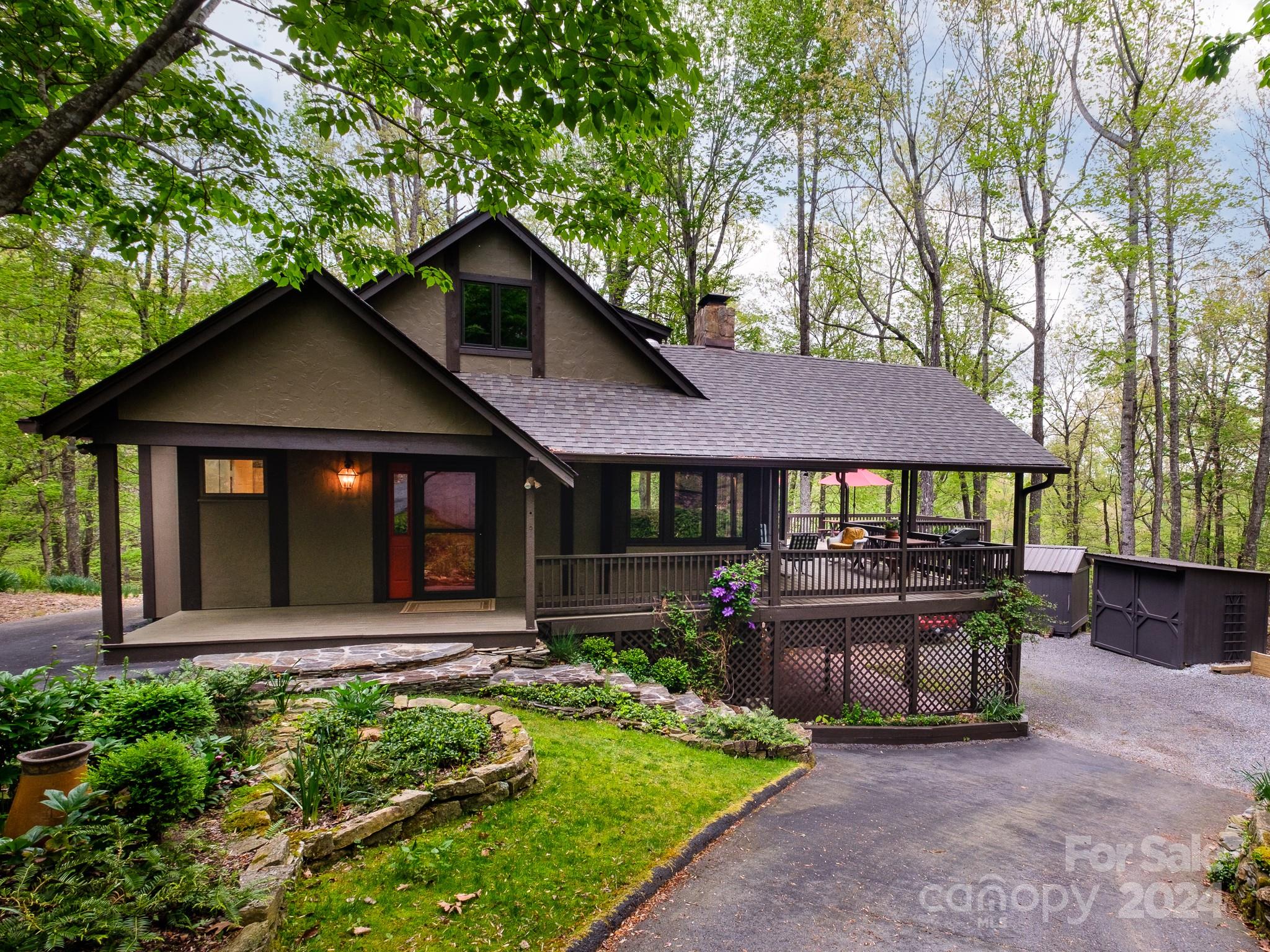 145 Catatoga Path Brevard, NC 28712 - Photo 2 of 41 a front view of a house with garden