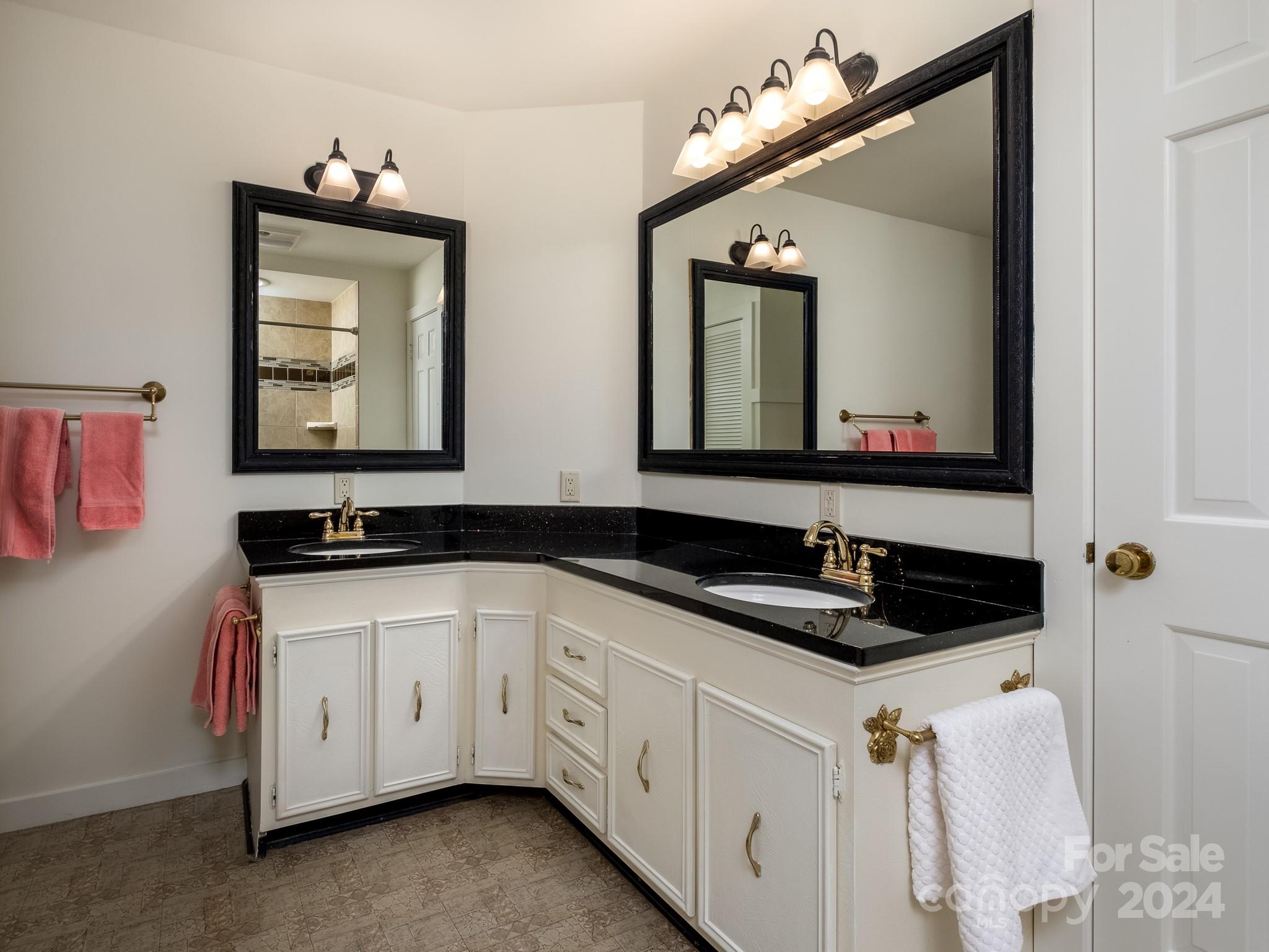 145 Catatoga Path Brevard, NC 28712 - Photo 21 of 41 a bathroom with a sink and a mirror