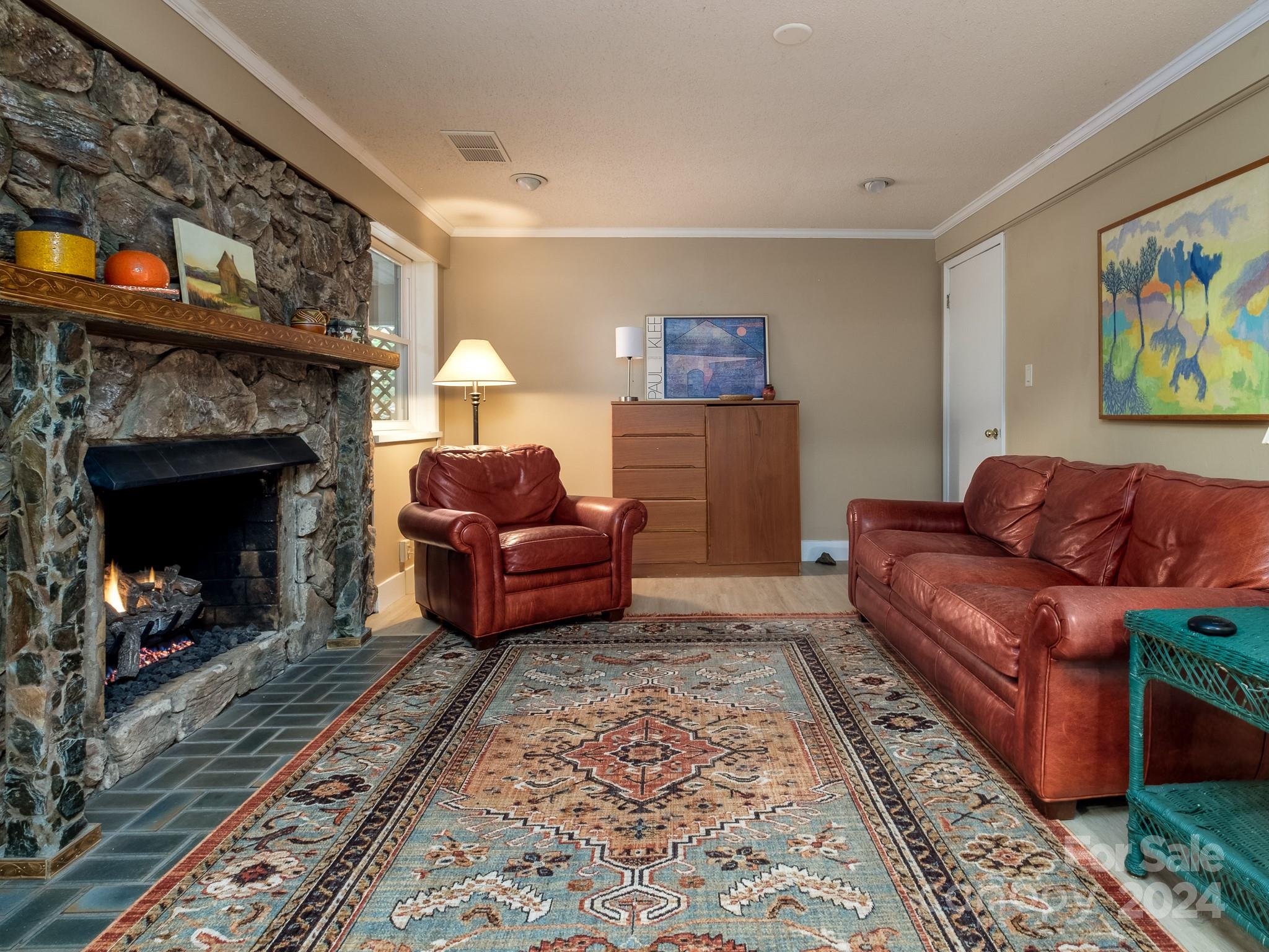 145 Catatoga Path Brevard, NC 28712 - Photo 23 of 41 a living room with furniture and a fireplace
