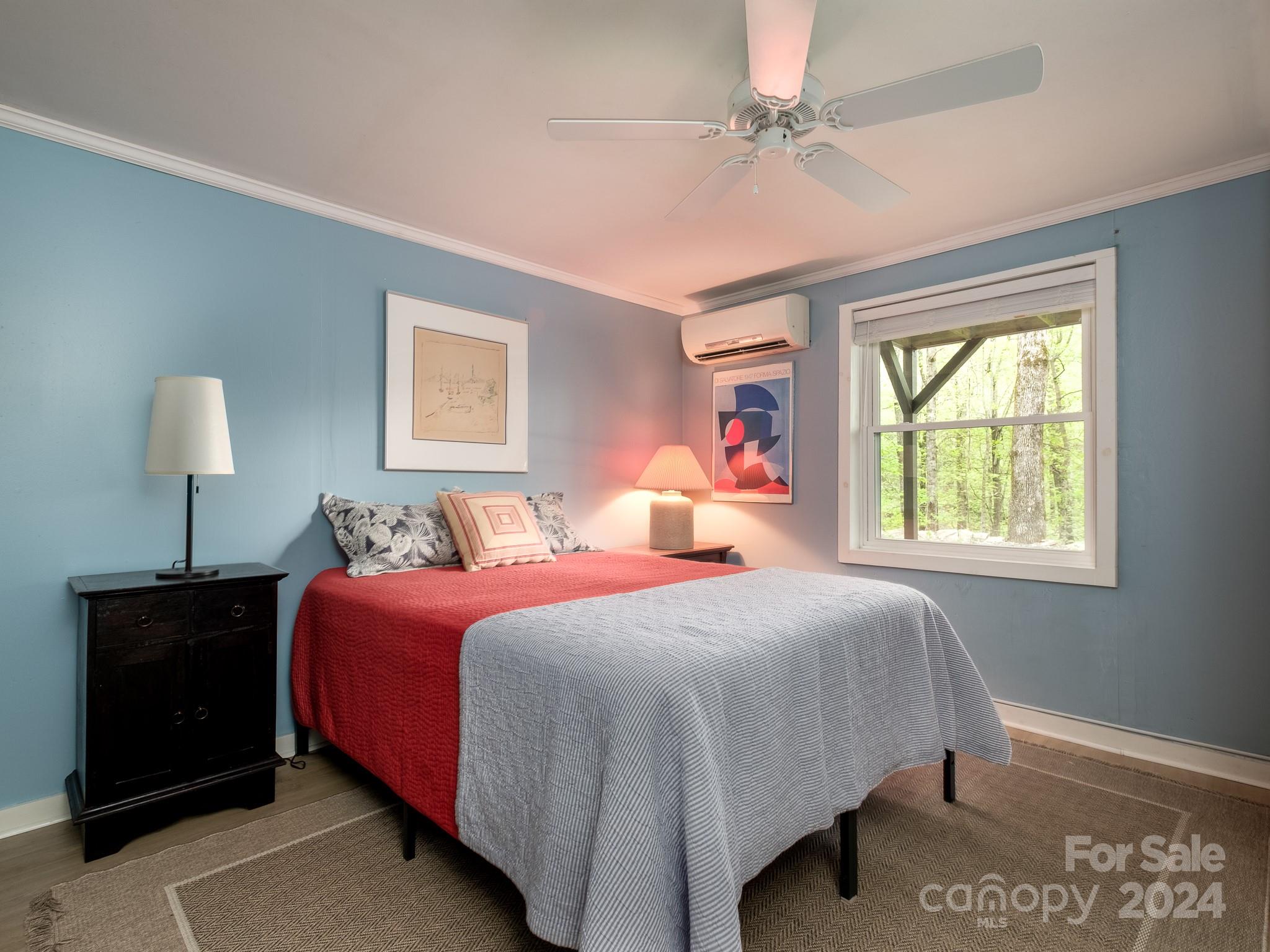 145 Catatoga Path Brevard, NC 28712 - Photo 28 of 41 a bedroom with a bed and a window