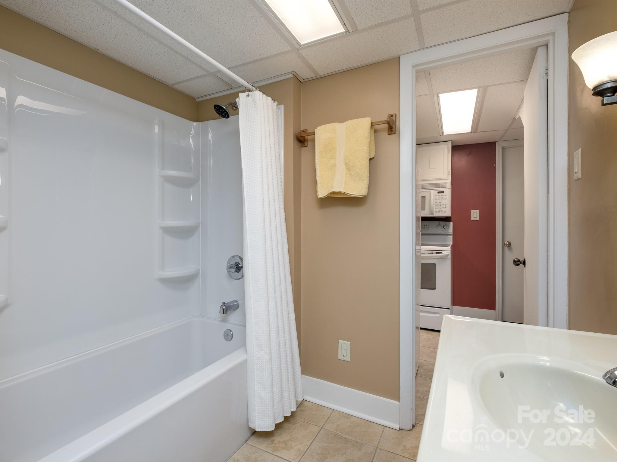 145 Catatoga Path Brevard, NC 28712 - Photo 30 of 41 a bathroom with a bathtub and a shower