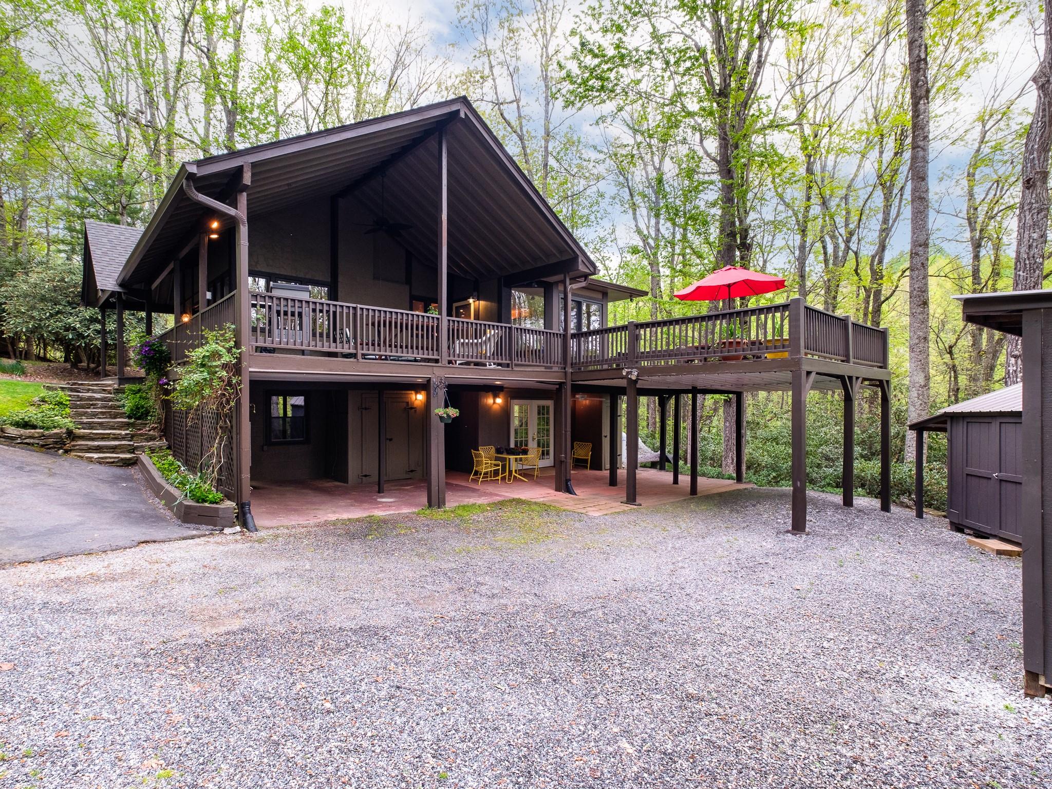 145 Catatoga Path Brevard, NC 28712 - Photo 4 of 41 a view of a house with a yard and sitting area