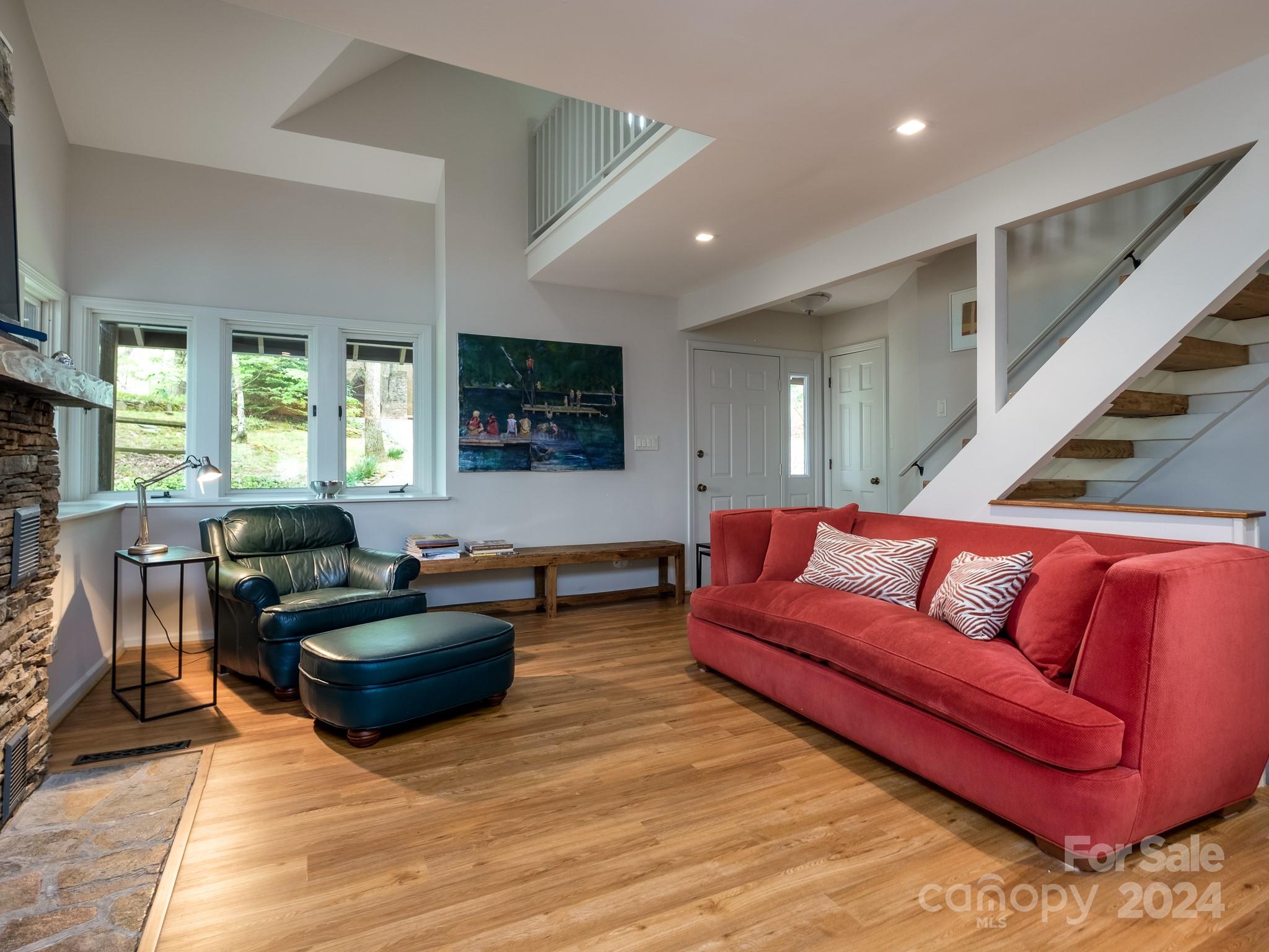 145 Catatoga Path Brevard, NC 28712 - Photo 9 of 41 a living room with furniture and a flat screen tv