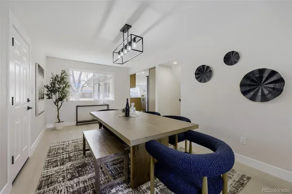 a view of a livingroom with furniture and a potted plant